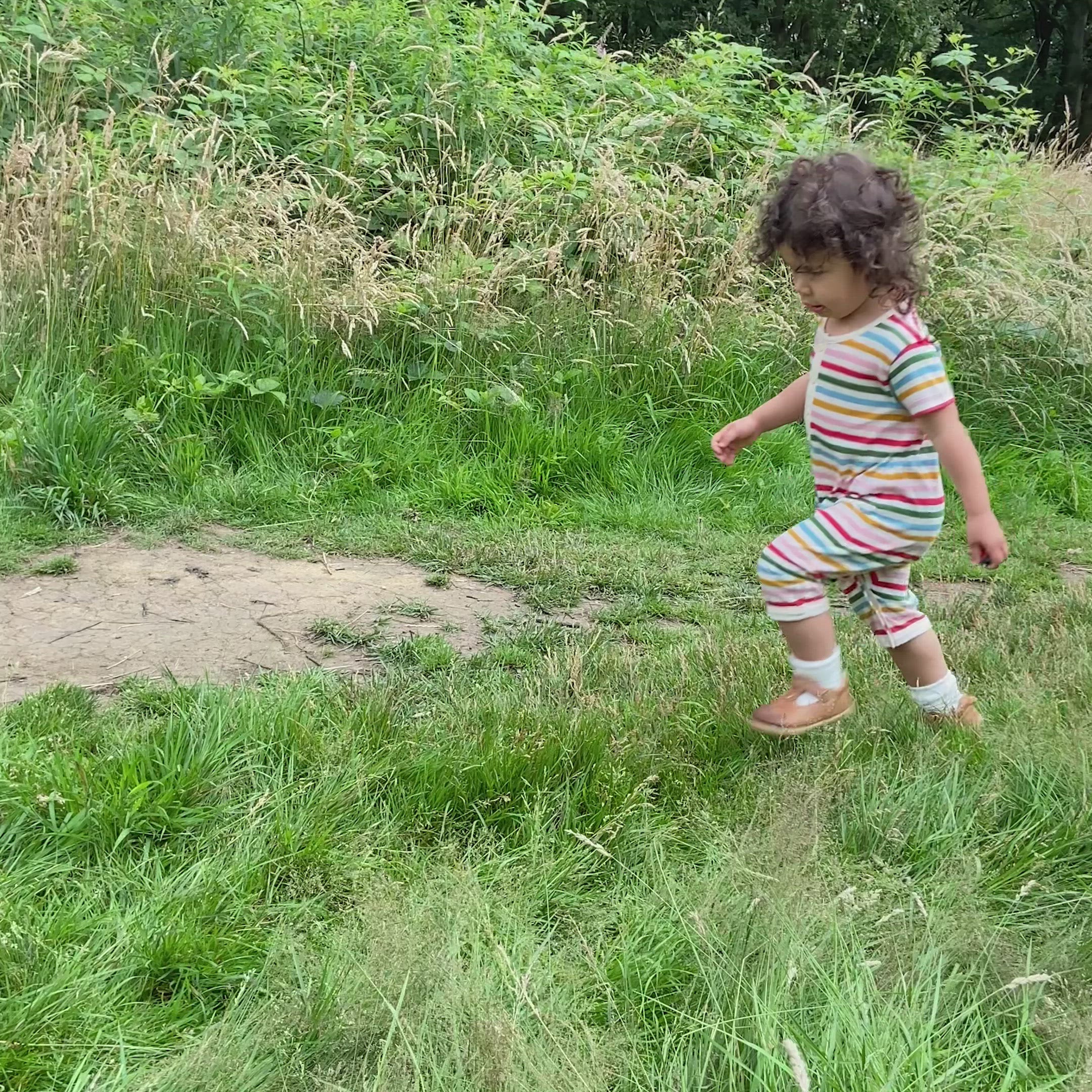 Load video: Rainbow Striped Organic Shortie Romper